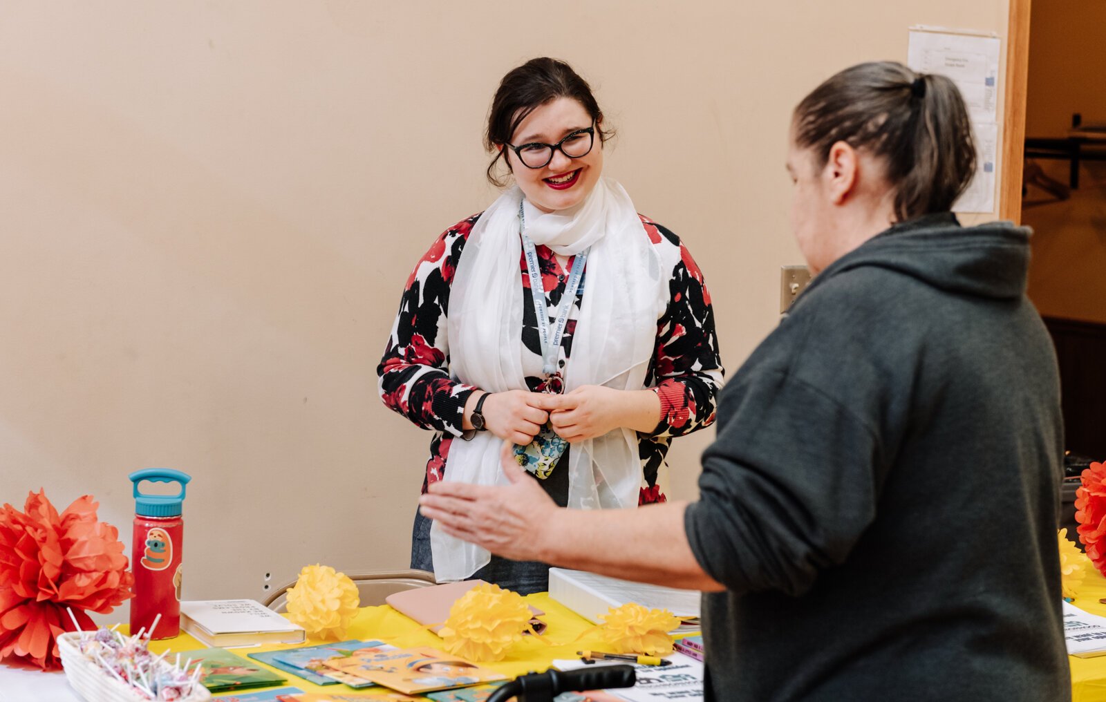 Bernadette Fellows, Community Engagement Planner with the City of Fort Wayne left, talks with a guest during the Fall Fest event at Harvester Missionary Church.