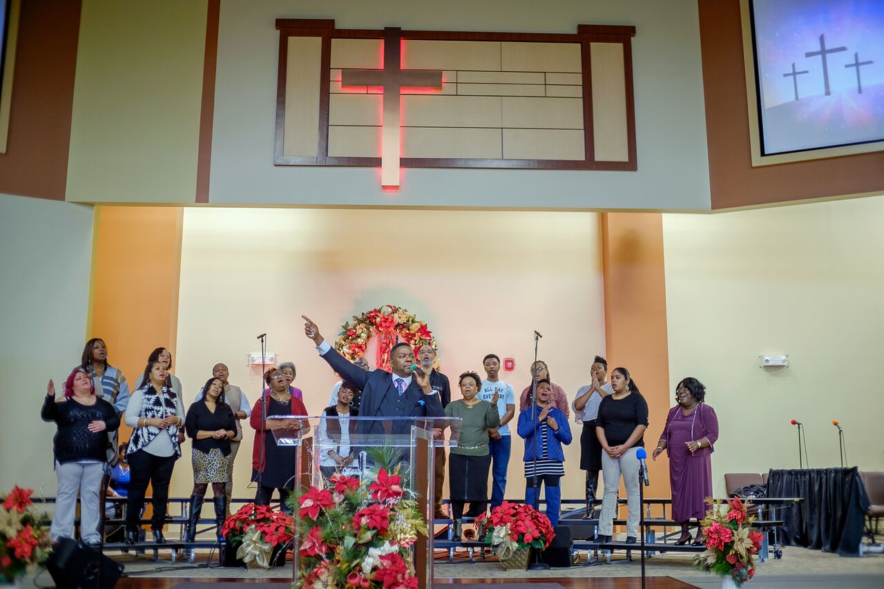 Members of the choir sing at New Covenant Worship Center at 3420 E. Paulding Rd.