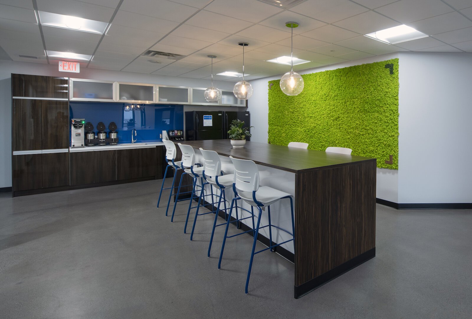 In its work with the Northeast Indiana Regional Partnership, Design Collaborative incorporated a “green wall” in the community breakroom to give employees a spark of color.