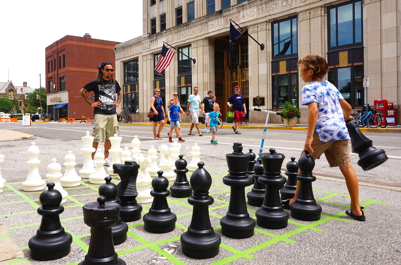 Checkmate! Residents played giant board games like Chess in the streets.