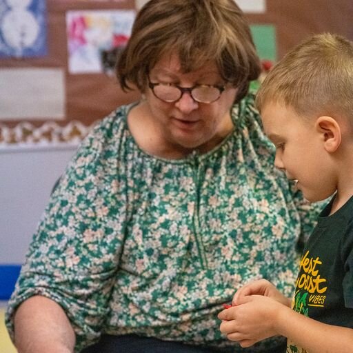 Foster Grandparent Pam works with a preschooler.