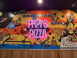 A mural inside Papi's Pizza Company on The Landing in Downtown Fort Wayne.