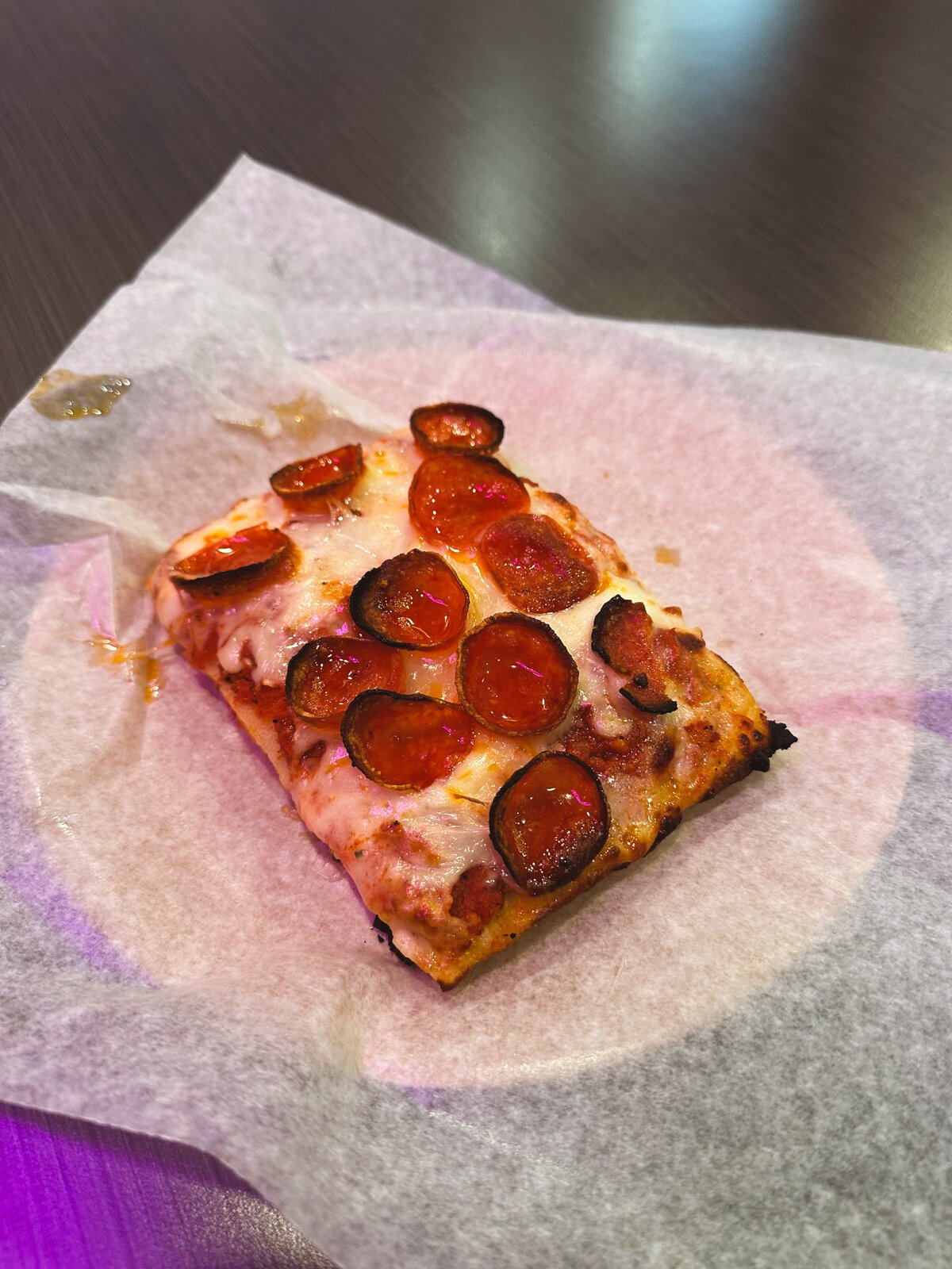A slice of Pepperoni Homie from Papi's Pizza.