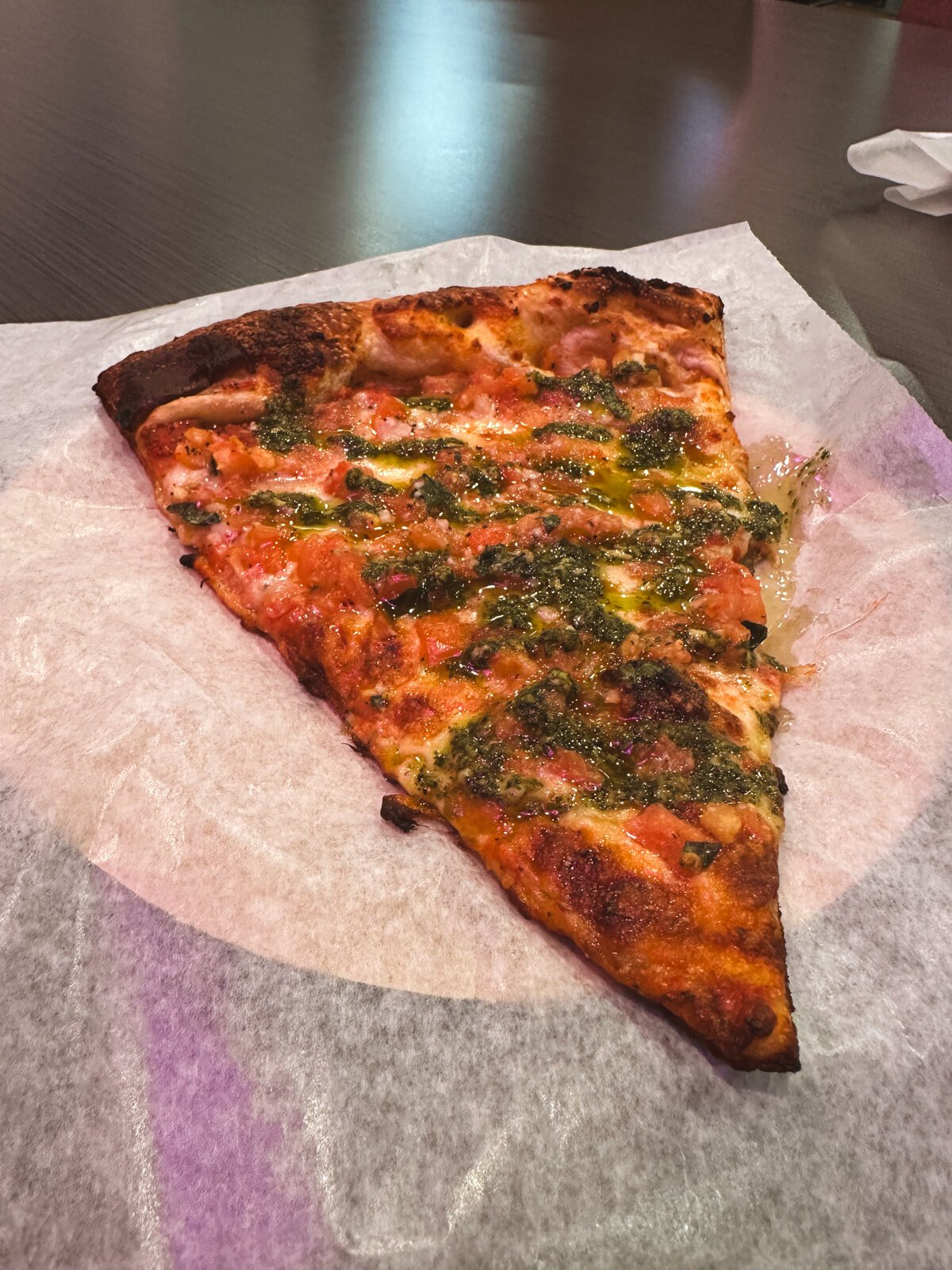 A slice of Tomato-Tony from Papi's Pizza Company.