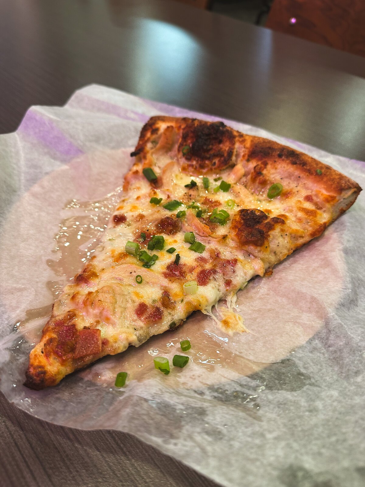 A slice of Chiki's Bacon Ranch from Papi's Pizza.