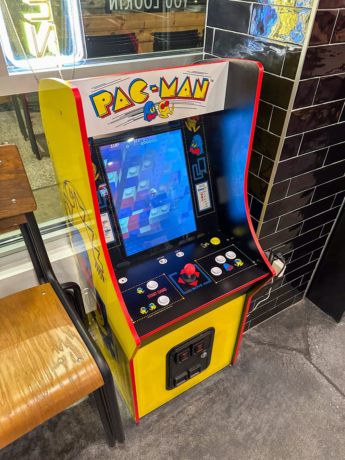 A Pac-Man game inside Papi's Pizza.