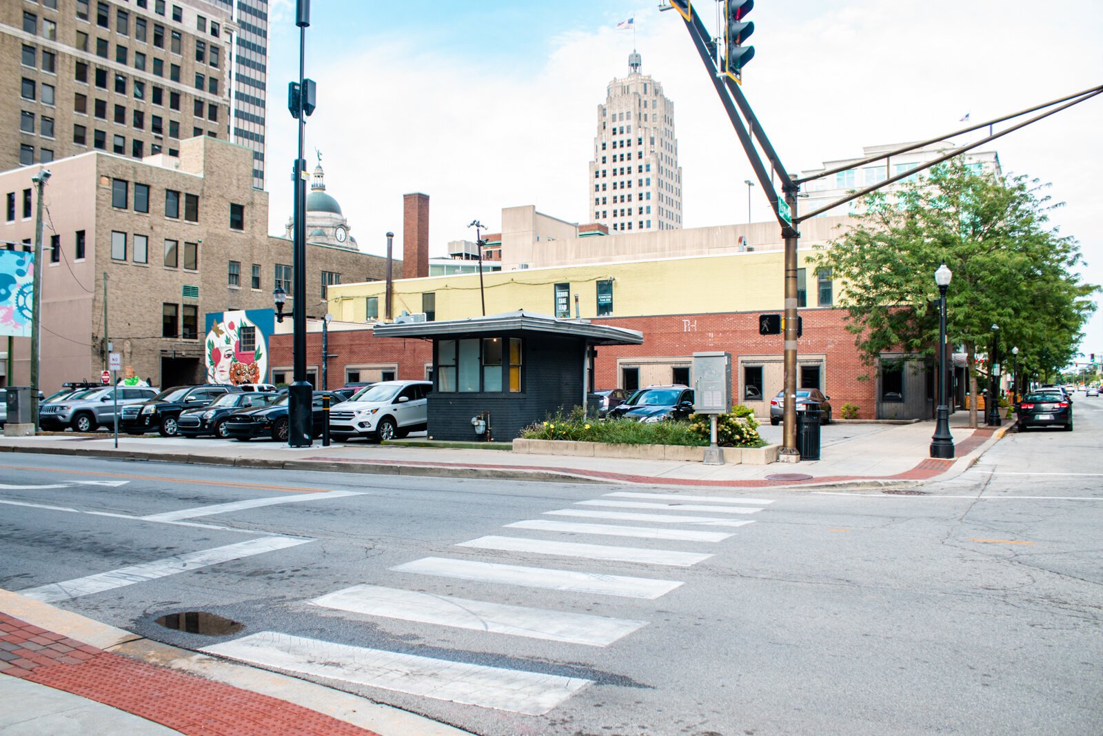 A surface lot at the corner of Harrison and Wayne Streets in the center of Downtown.