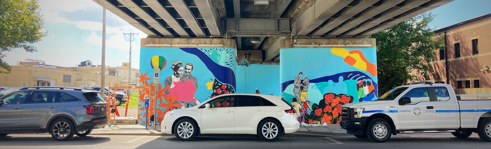 A new Art This Way project, called The Unity Mural, is currently being created steps away from The Landing at the railroad underpass near Harrison and Dock streets.