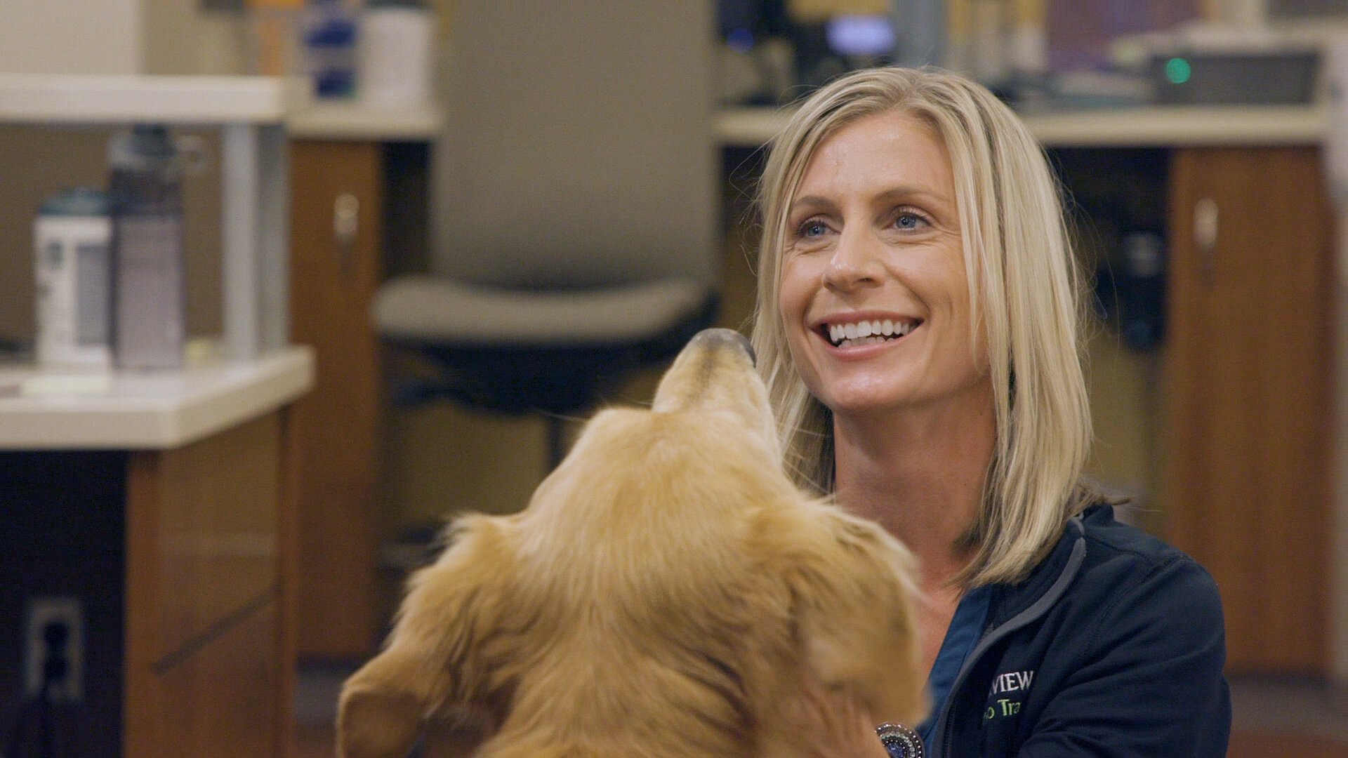 Samuel, a Parkview Pup, greets a co-worker.