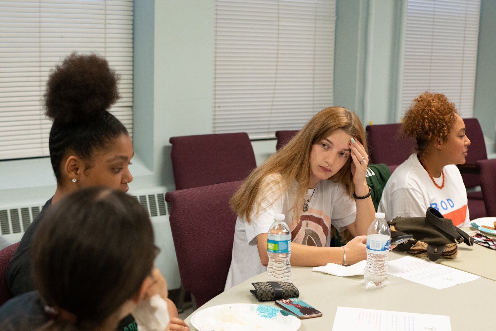 Caroline Shroyer talks with fellow students who are part of the Peacemaker Academy during a meeting led by director Angelo Mante at First Wayne St. United Methodist Church.