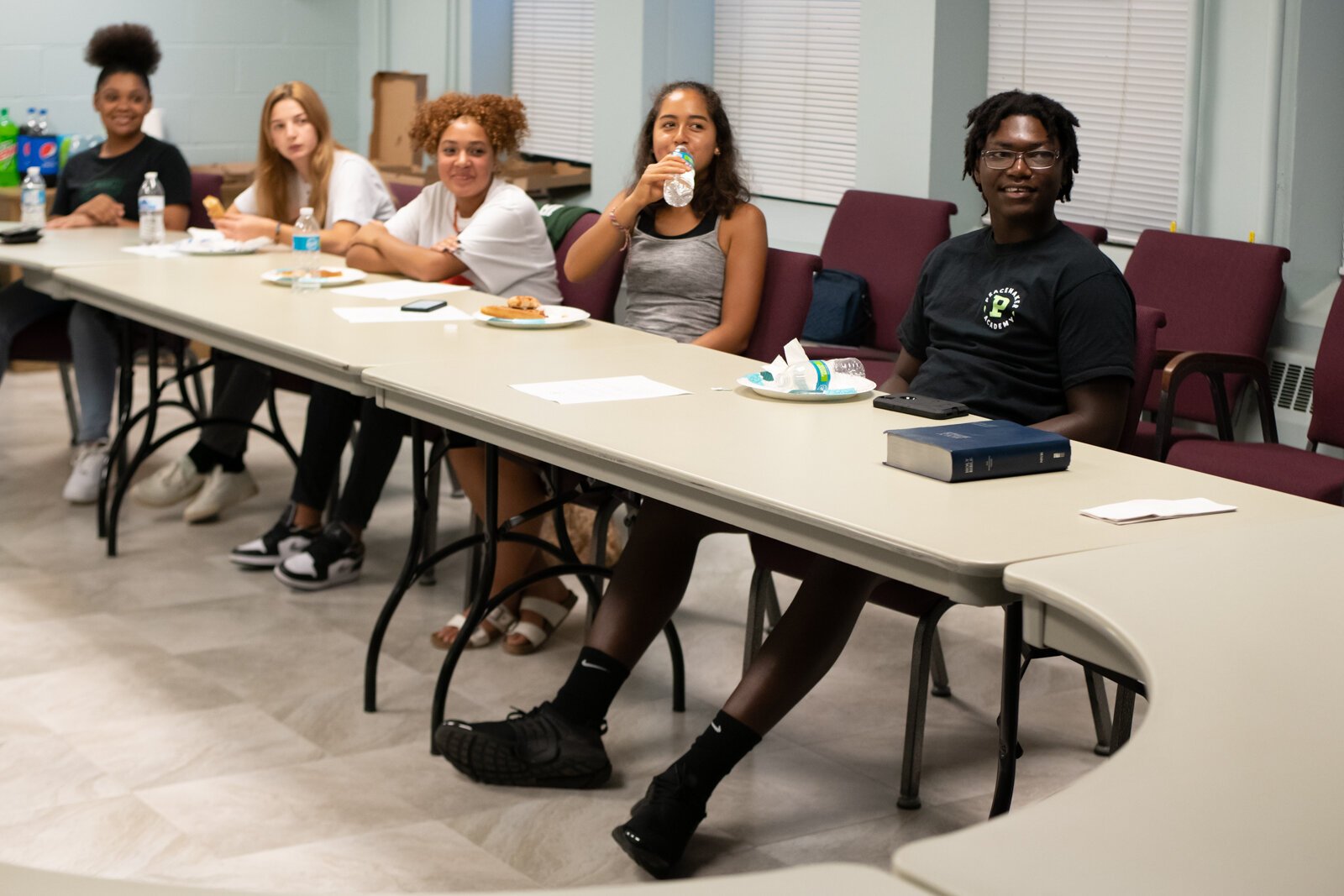 Dazhon Ware talks with members who are part of the Peacemaker Academy via a Zoom call during a meeting led by director Angelo Mante at First Wayne St. United Methodist Church.