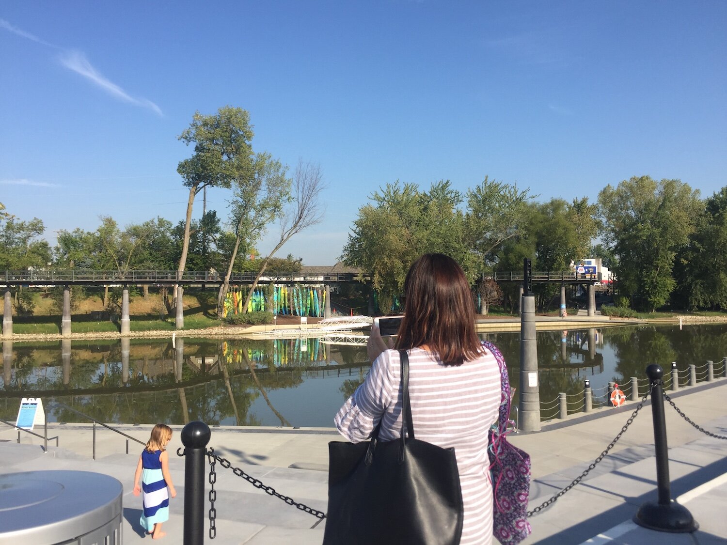 Travel writer Trisha Brand of Indianapolis tours downtown Fort Wayne's Promenade Park with her family.