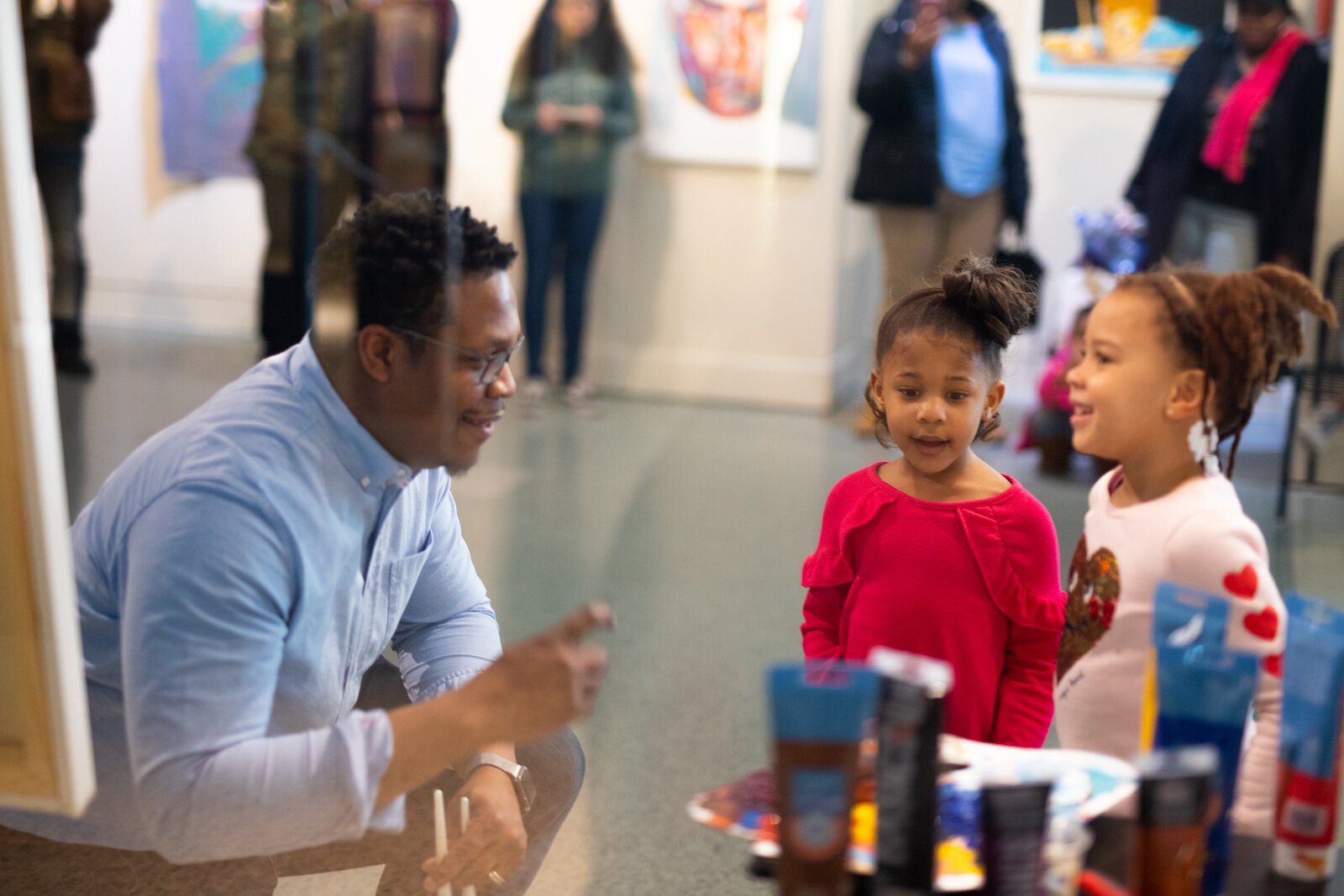 Theopolis Smith III, the artist behind Phresh Laundry, talks to children at the Jeffrey R. Krull Art Gallery inside the Allen County Public Library in 2019.