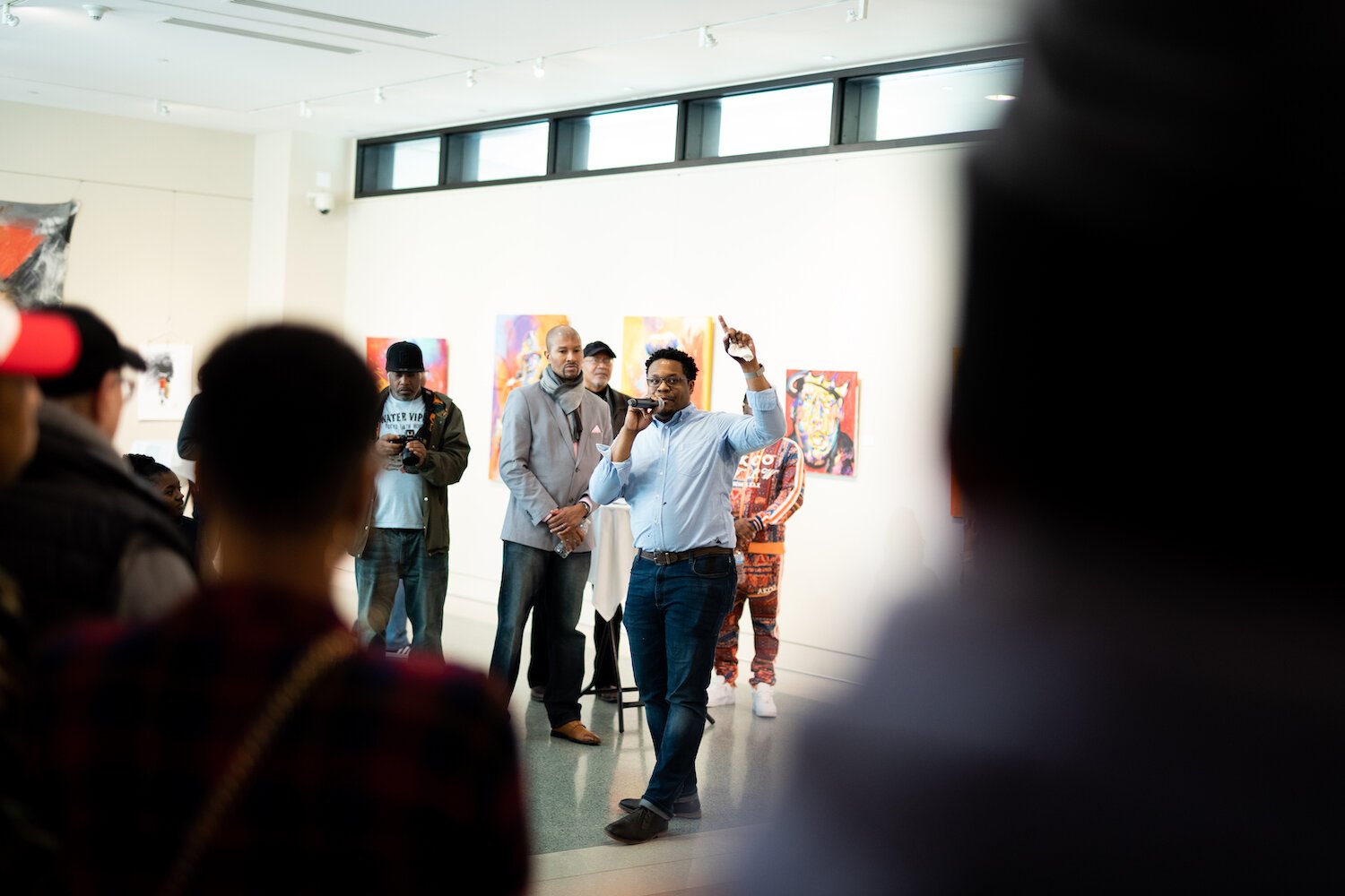 Artist Theopolis Smith III addresses the crowd at the Jeffrey R. Krull Art Gallery.