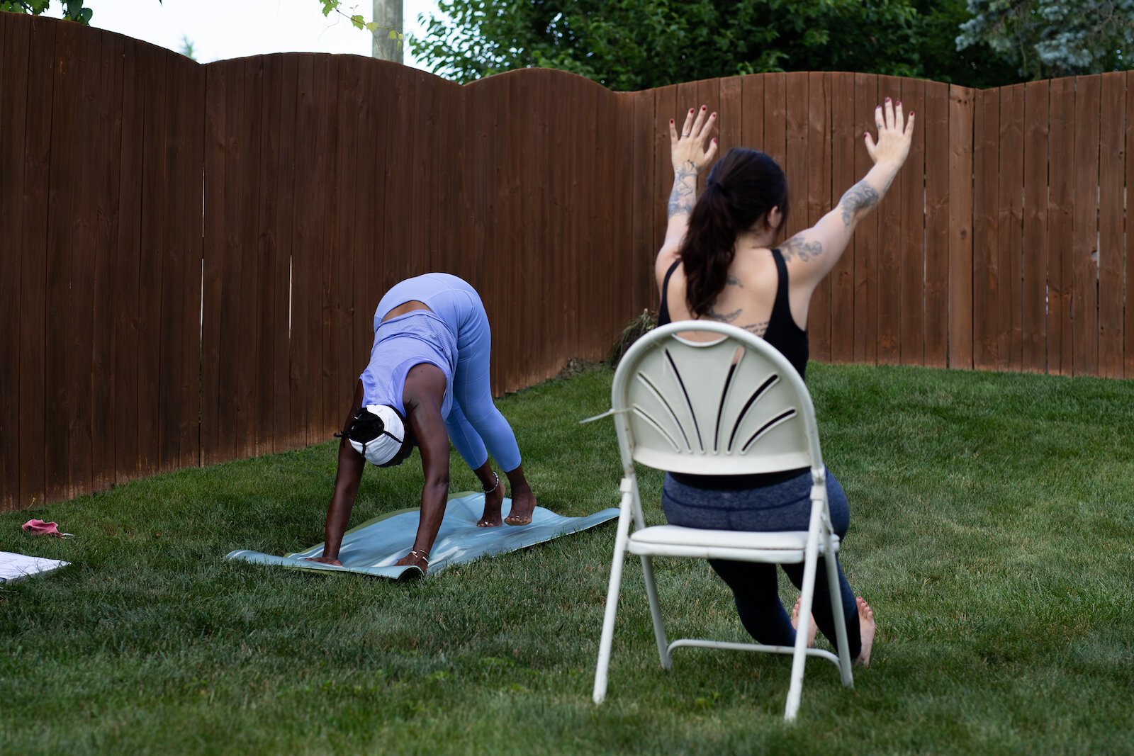 Diane Rogers, left, and Haley Evans, right, lead an inclusive, outdoor yoga class for Rooted Connection, LLC.