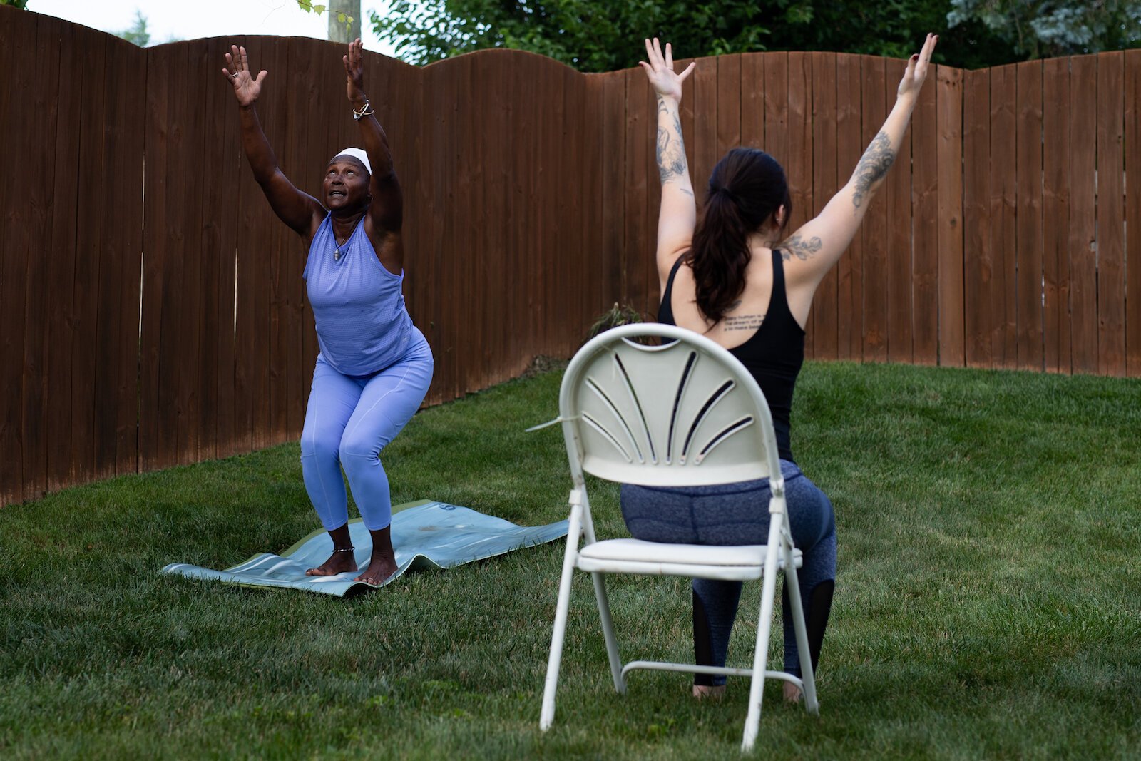 Diane Rogers, left, and Haley Evans, right, lead an inclusive, outdoor yoga class for Rooted Connection, LLC.