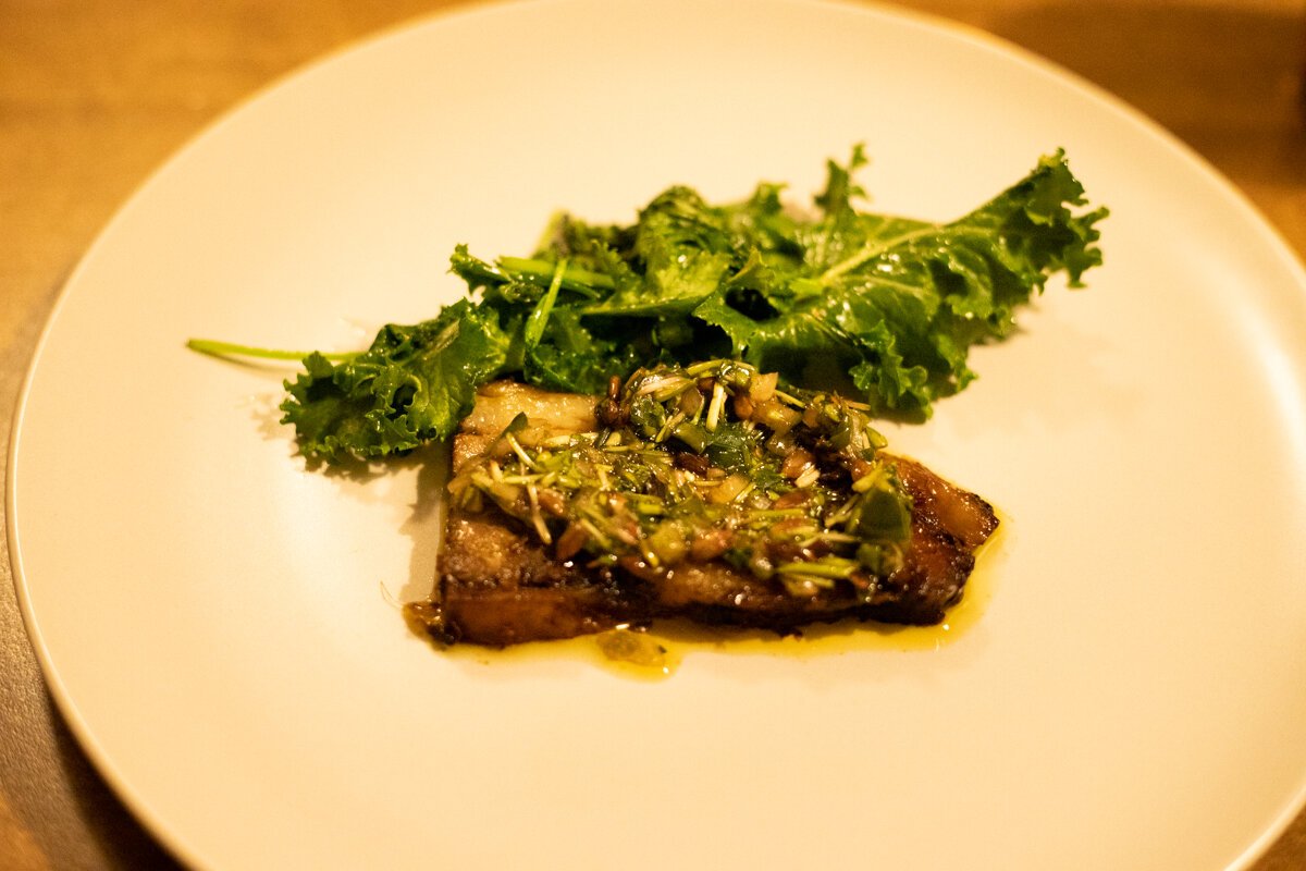 The sixth course features a rich, succulent brisket cooked in a garlicky, chili-forward pinakurat.