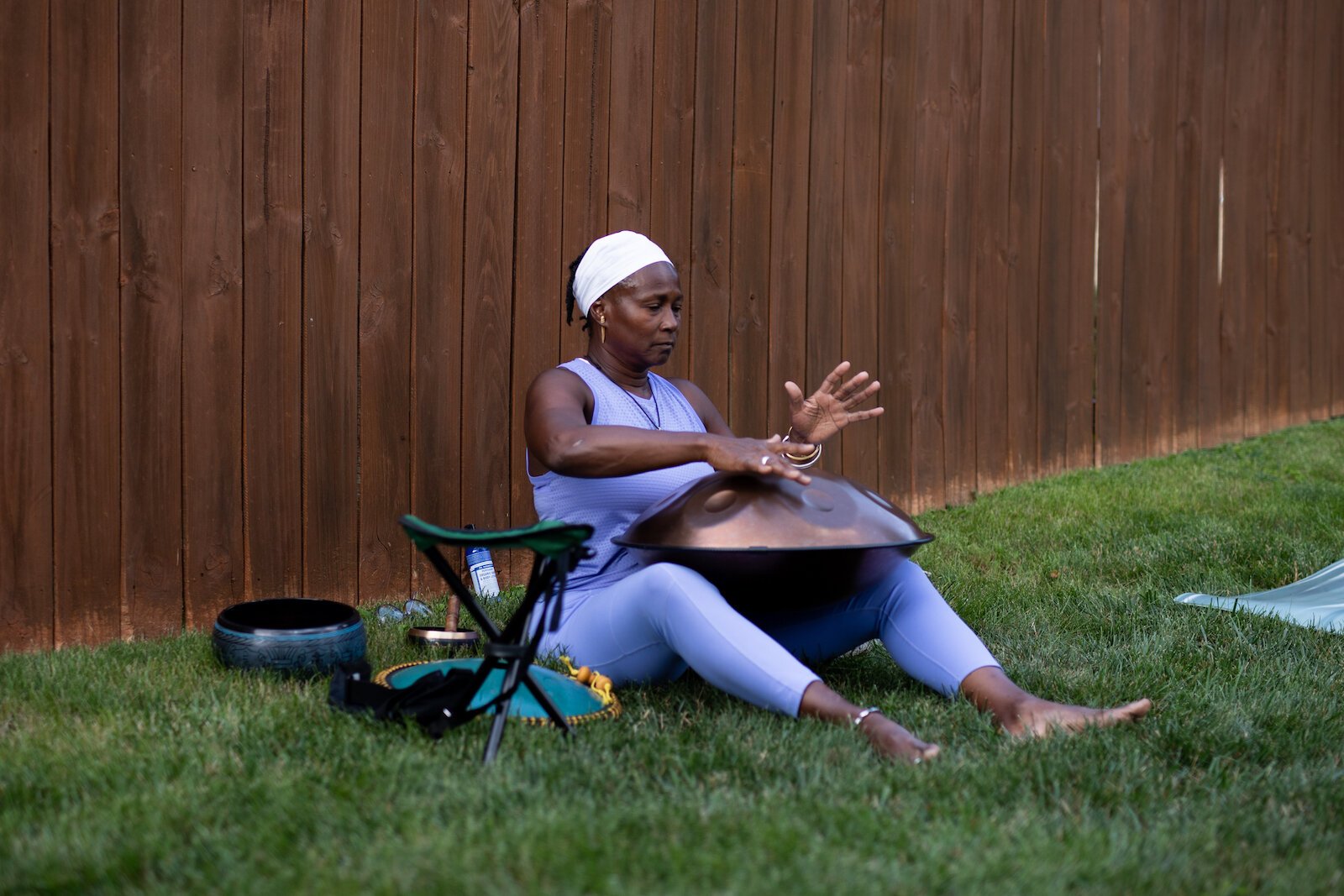 Diane Rogers of Rooted Connection, LLC, ushers participants into and out of the experience with her melodic 432 frequency handpan, or hang, drum.