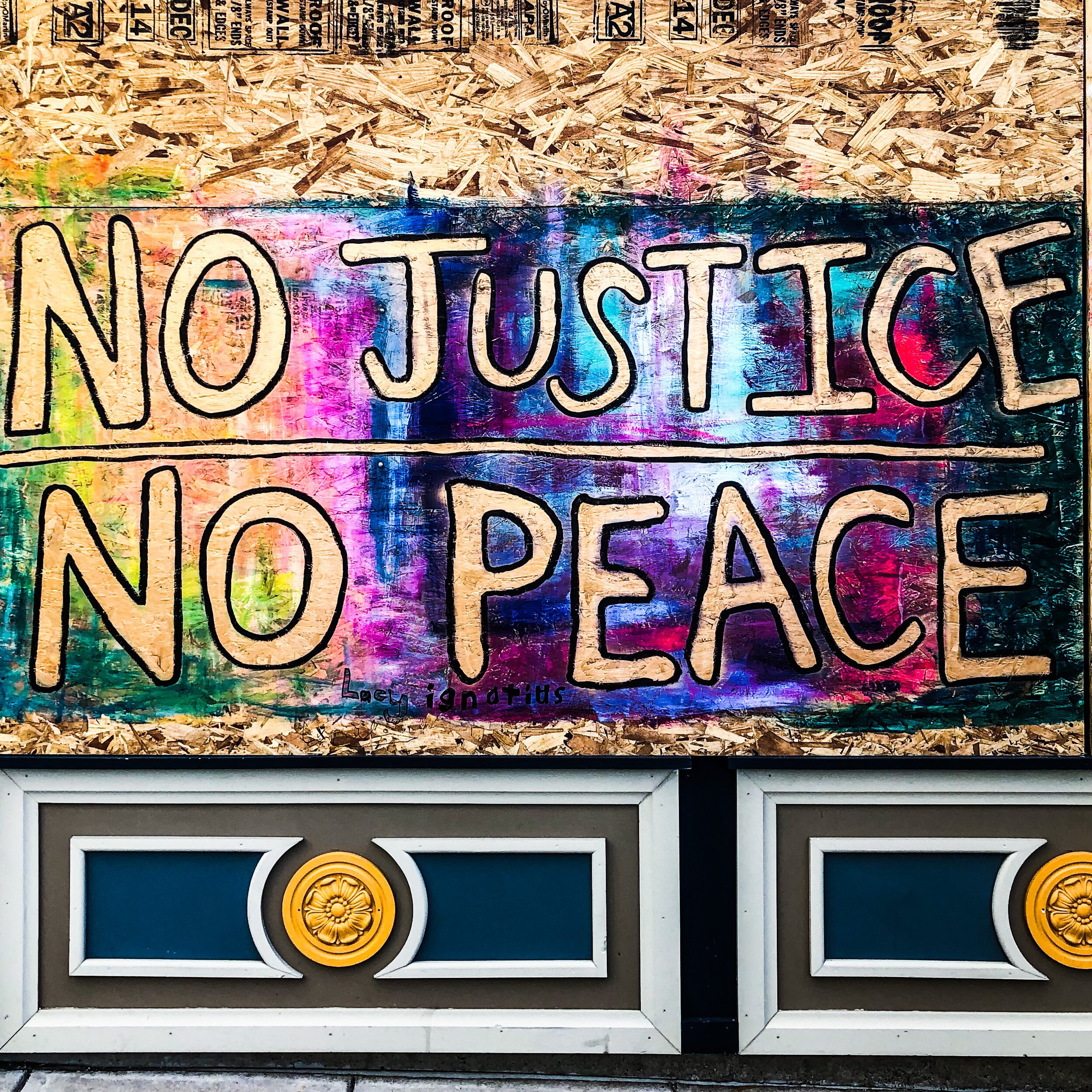 Alyssum Montessori School transformed its broken windows into murals supporting a nonviolent protest.