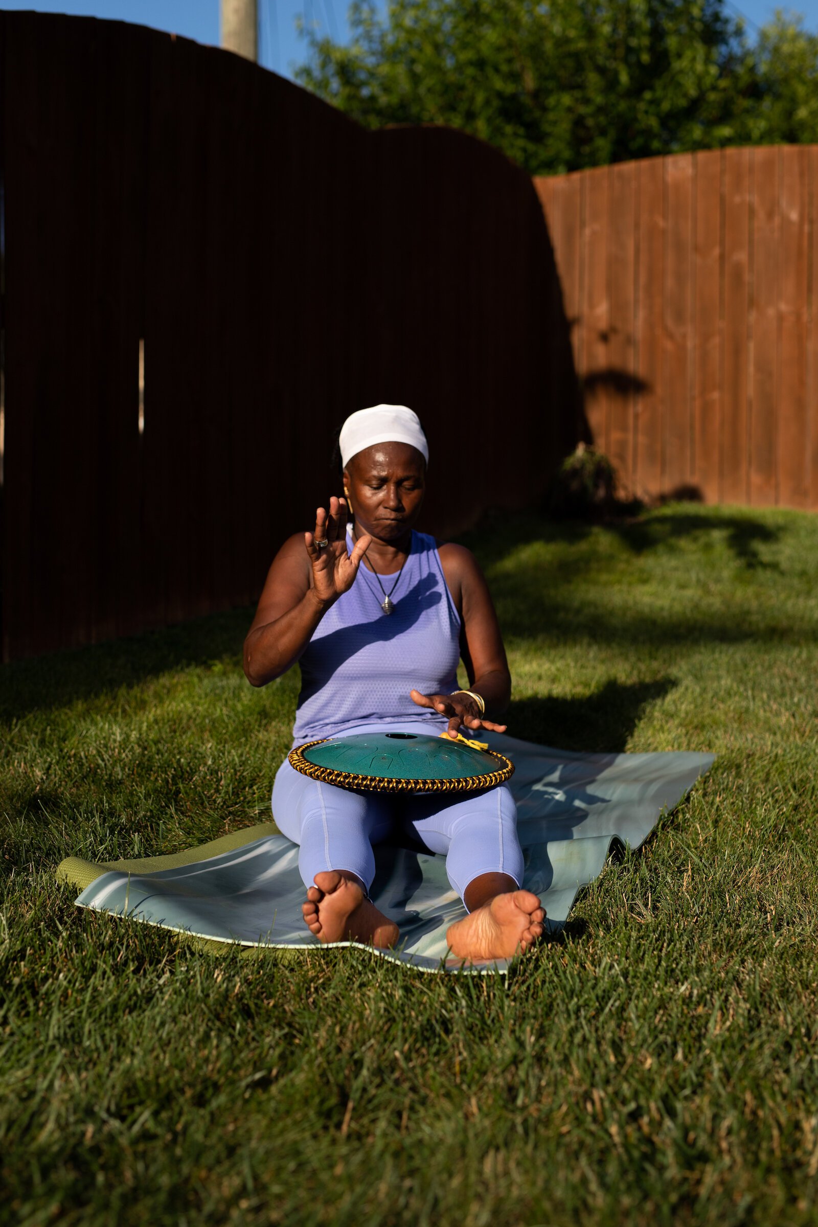 Diane Rogers uses a tongue drum and various singing bowls during the class.