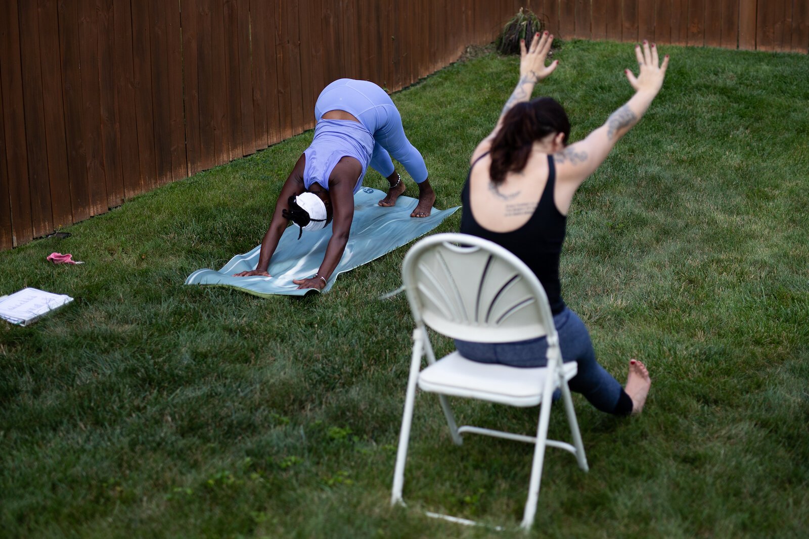 Diane Rogers, left, and Haley Evans, right, lead an inclusive, outdoor yoga class for Rooted Connection, LLC.