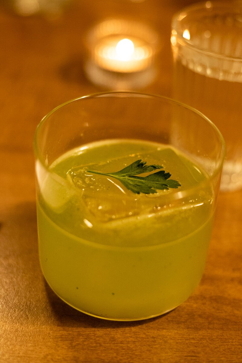 My cocktail arrives first, containing Lillet Blanc, Galliano, limoncino, parsley, and lemon.