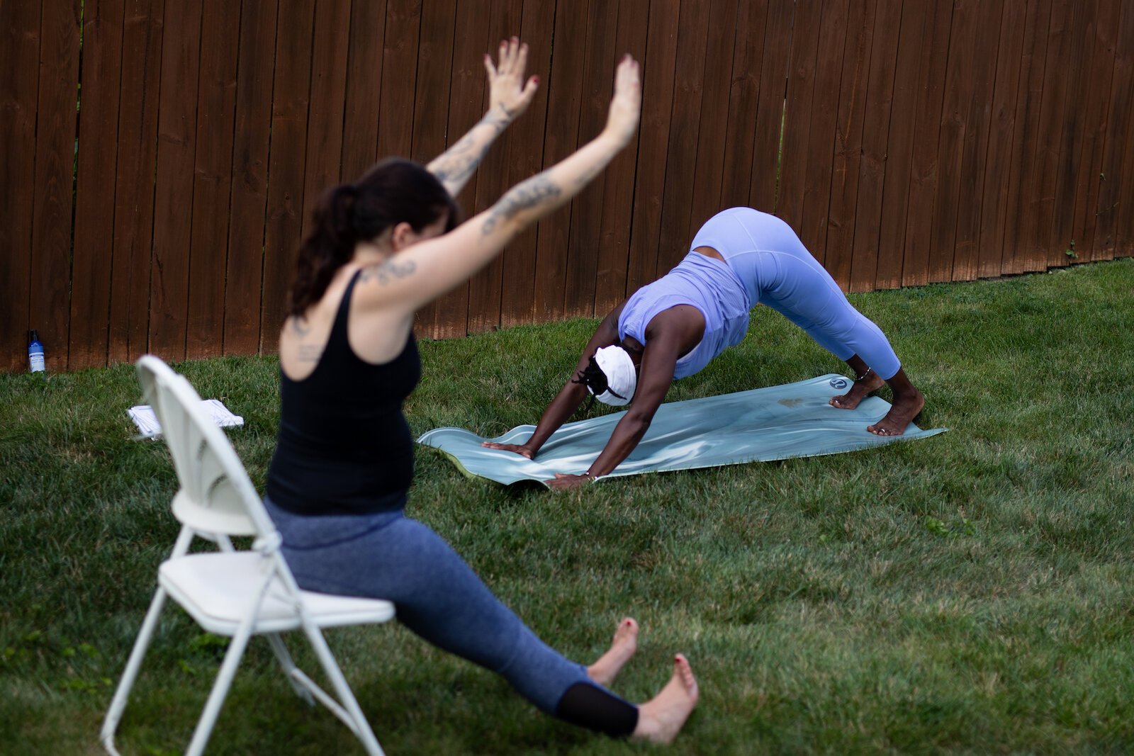 Diane Rogers, left, and Haley Evans, right, lead an inclusive, outdoor yoga class for Rooted Connection, LLC.