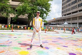 Fort Wayne artist Adam Garland invited the public to help create a new permanent mural downtown with biodegradable, paint-filled water balloons.