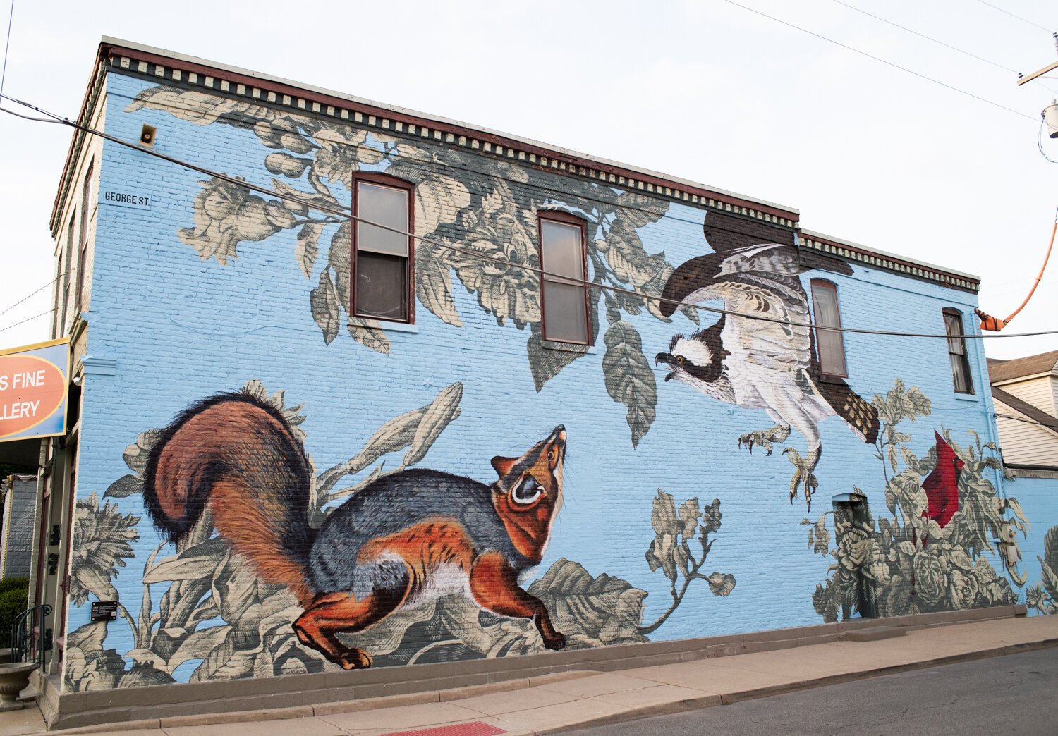 A mural by USF students led by artist Tim Parsley at 1217 Broadway on the side of Aaron’s Fine Rug Gallery in downtown Fort Wayne.