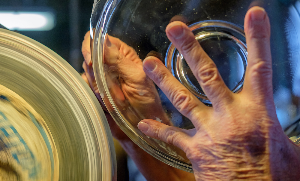 Randy hand-cuts a glass bowl at Warsaw Cut Glass.