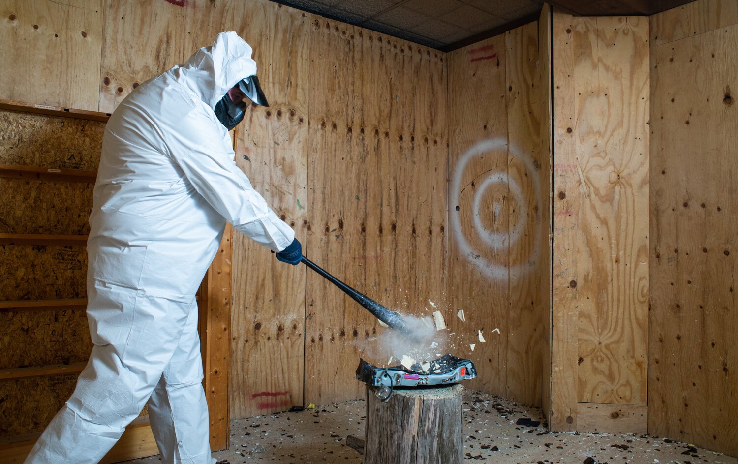 Customer Scott Zent smashes an object in his rage room.
