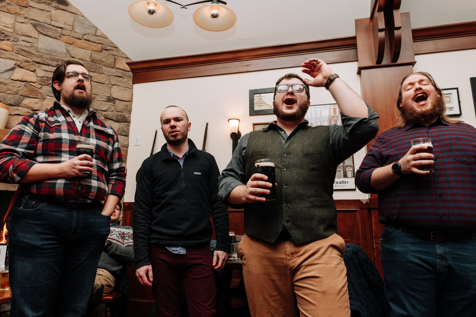 From left: Oscar Matter, Jonathan Casey, Stephen Stachofsky, and Braxton Matthews of the Ragtag Bunch sing during a performance at J.K. O’ Donnell’s on February 24, 2022.