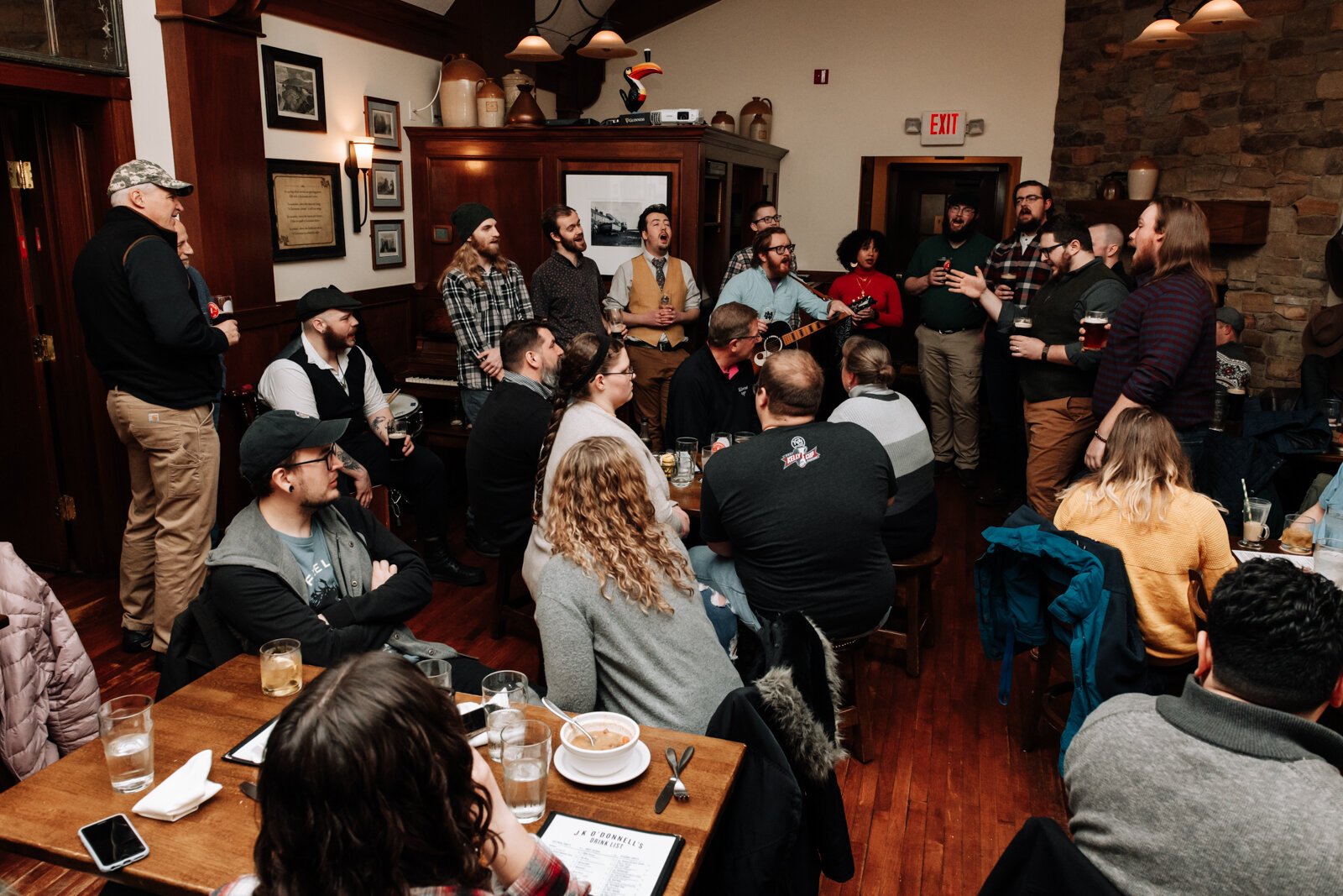 Members of the Ragtag Bunch sing during a performance at J.K. O’ Donnell’s on February 24, 2022.