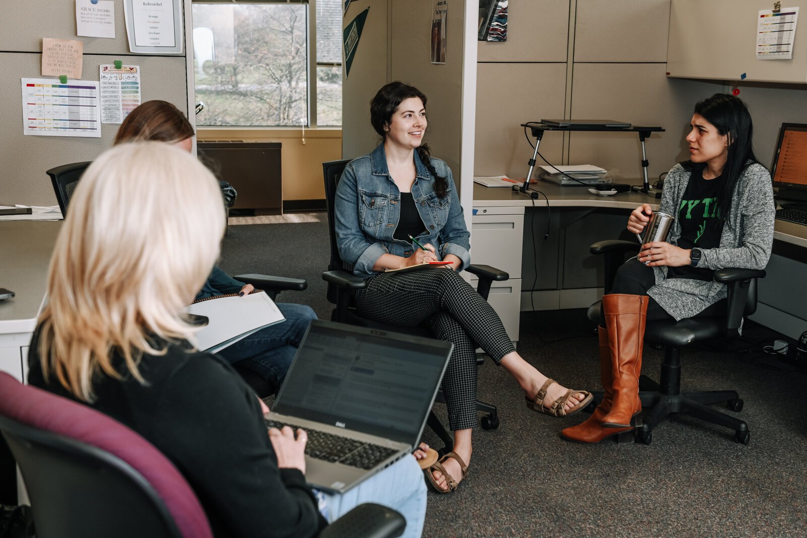 Hybrid work changes how Ivy Tech's Career Coaching and Employer Connections Office interacts with their space. Center is Meghan Stevens, a Talent Connection Manager.