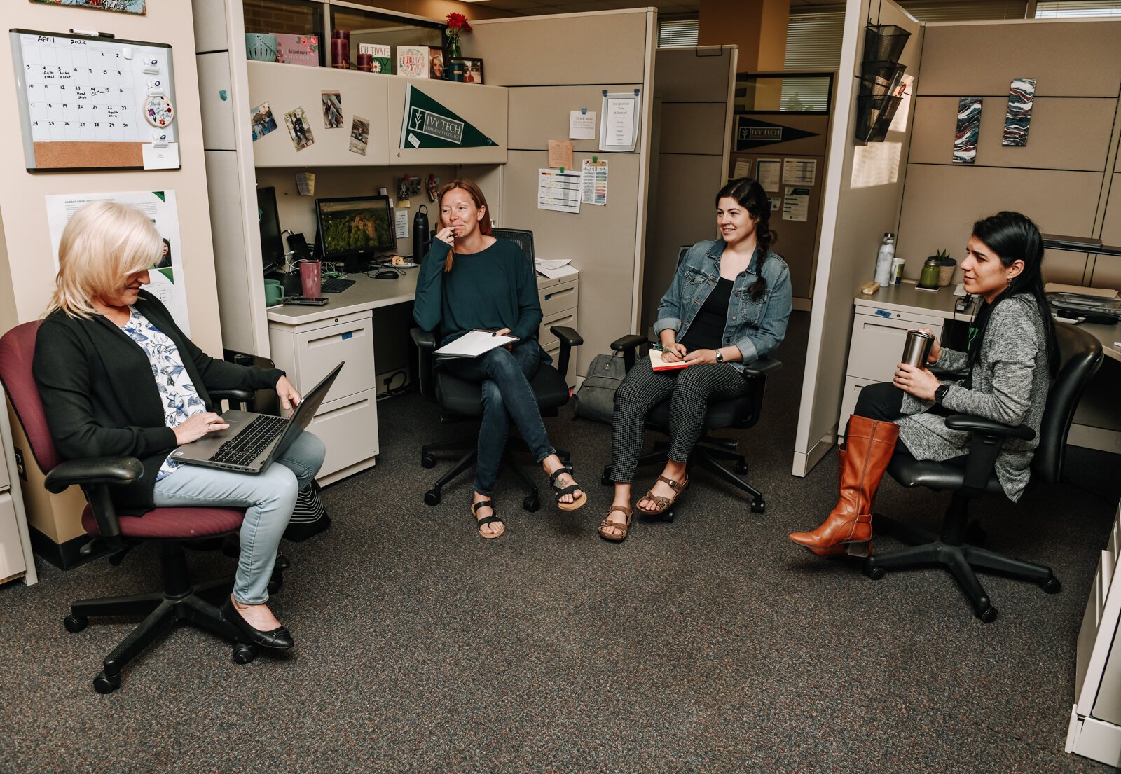 Hybrid work changes how Ivy Tech's Career Coaching and Employer Connections Office interacts with their space. Second from the right is Meghan Stevens, a Talent Connection Manager.