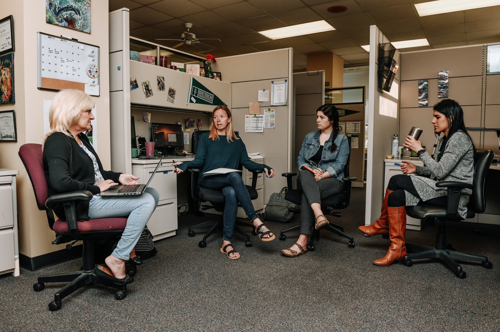 Hybrid work changes how Ivy Tech's Career Coaching and Employer Connections Office interacts with their space. Second from the right is Meghan Stevens, a Talent Connection Manager.