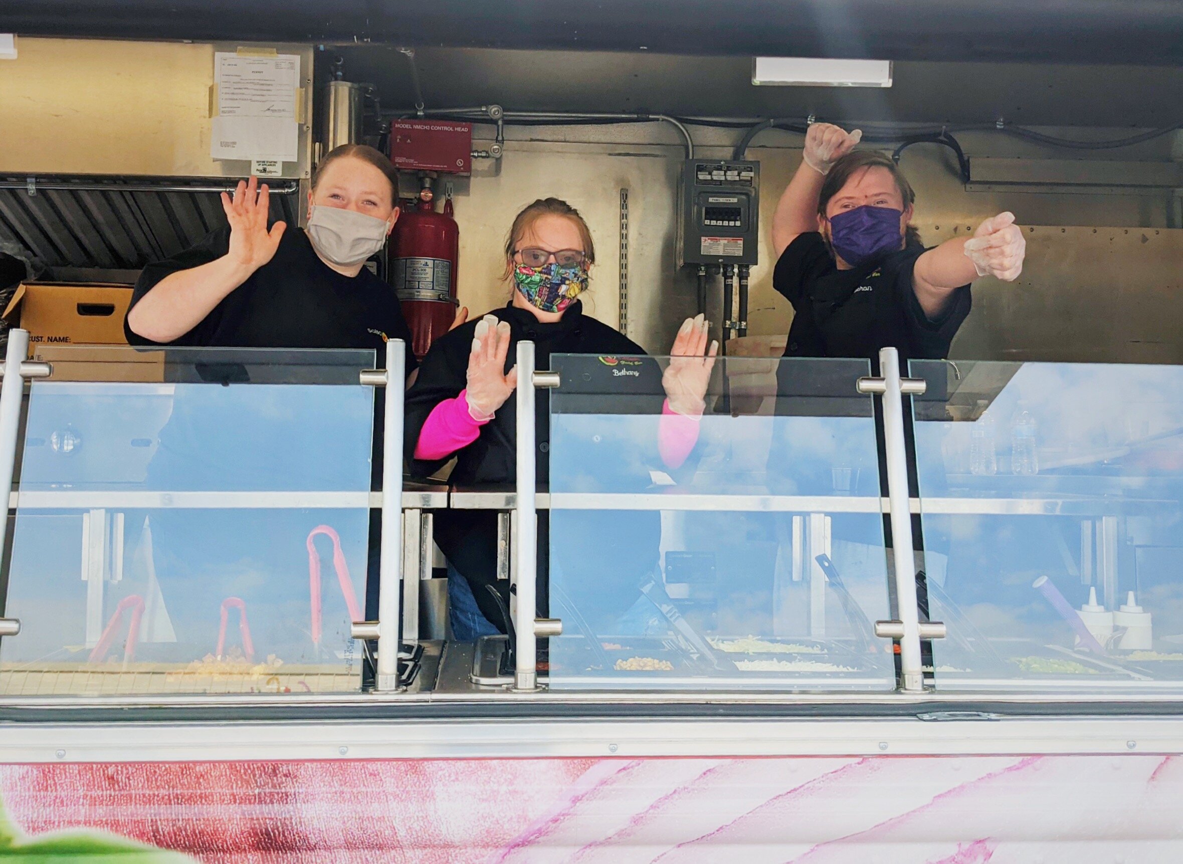 GiGi's Ambassadors Bethany Jewell and Cameron Shomo work in the Salsa Grille Food Truck.