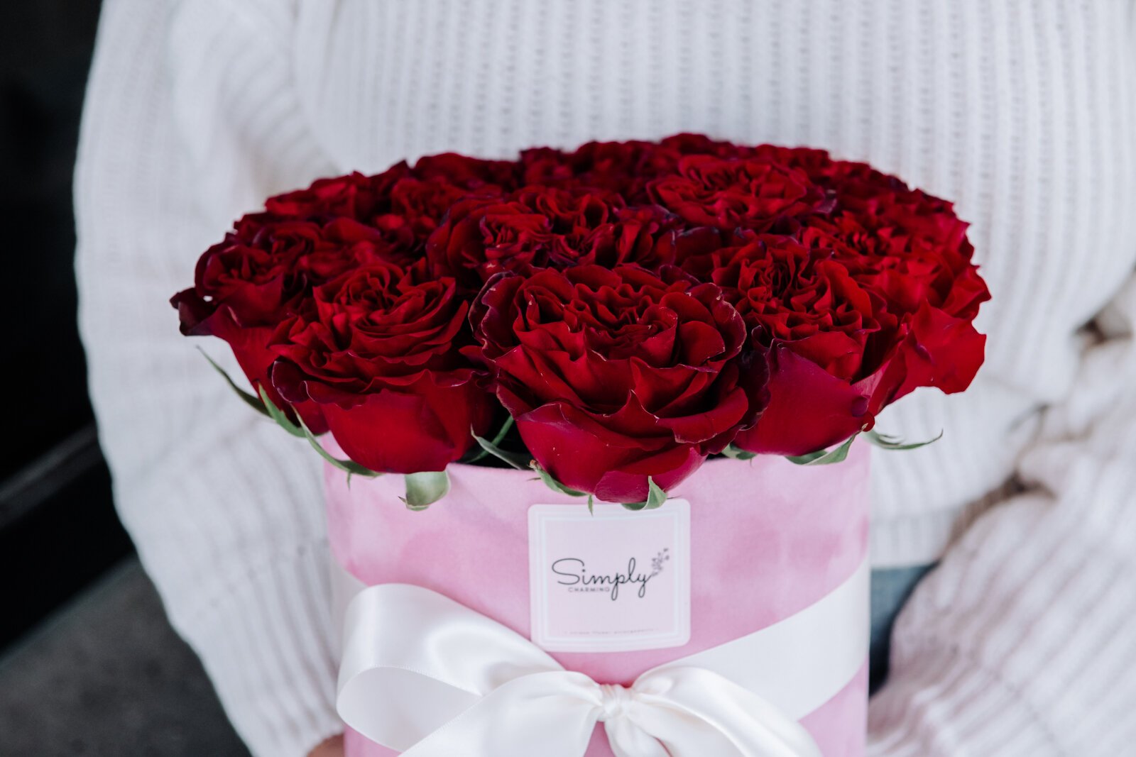 Samantha Cazares of Simply Charming holds her Rose Box Arrangement.