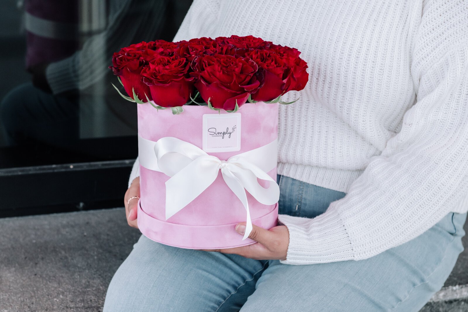 Samantha Cazares of Simply Charming holds her Rose Box Arrangement.