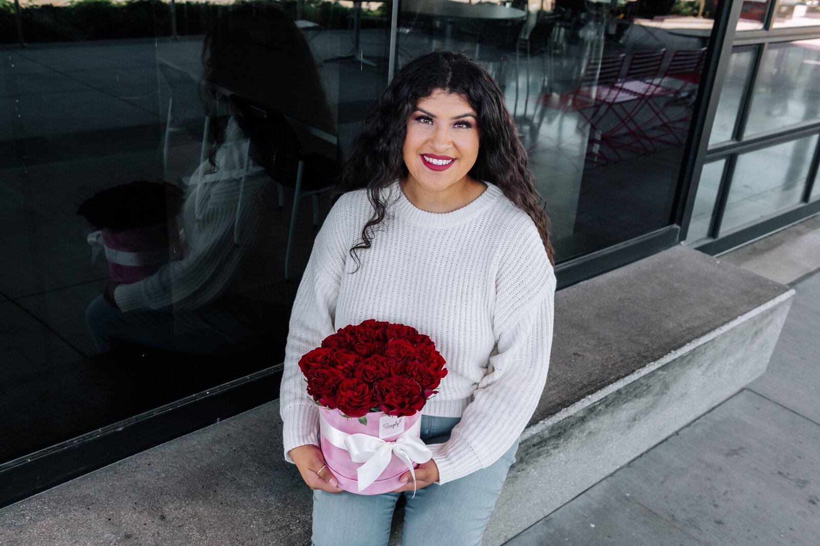 Samantha Cazares of Simply Charming holds her Rose Box Arrangement.