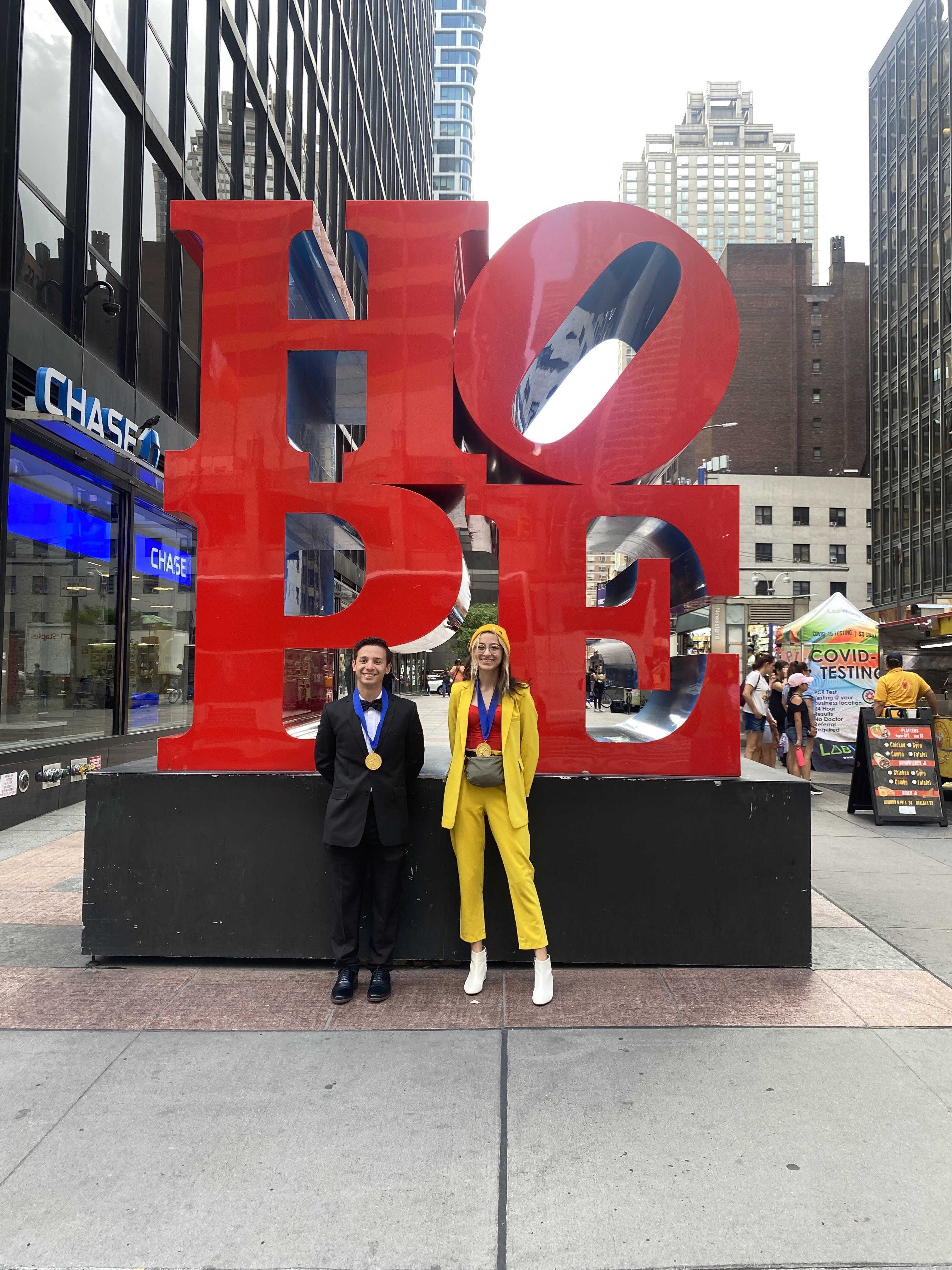 Gold Medal recipients Jared Sagan, Homestead High School, and Natalie Timmerman, Ottawa Hills High School, OH., in front of Robert Indiana’s HOPE sculpture after the Scholastic National Ceremony.