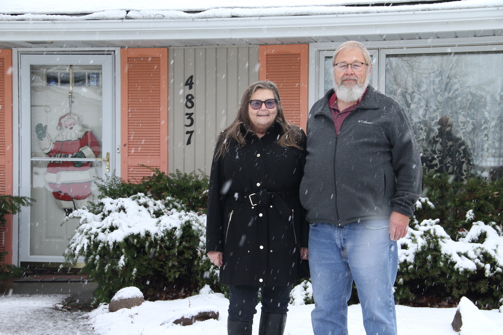 Joanne and Scott Randolph stand outside their Fort Wayne home, which once belonged to actress from The Office, Jenna Fischer.