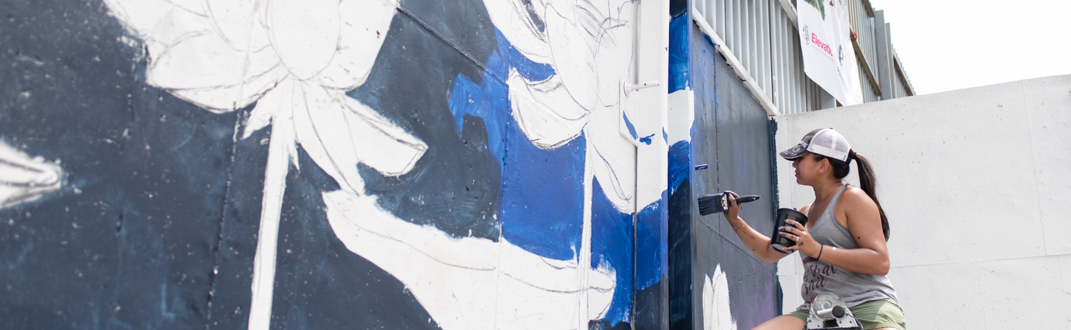 Nancy Fritz works on her mural during "Elevation. A Summit City Mural Showcase" on the 2400 block of Central Dr. in Fort Wayne.