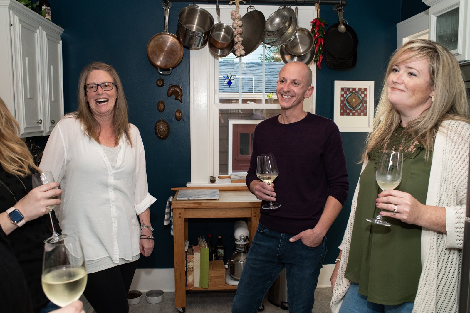 Kevin Christon spends time with friends in the kitchen of his home in The '05.