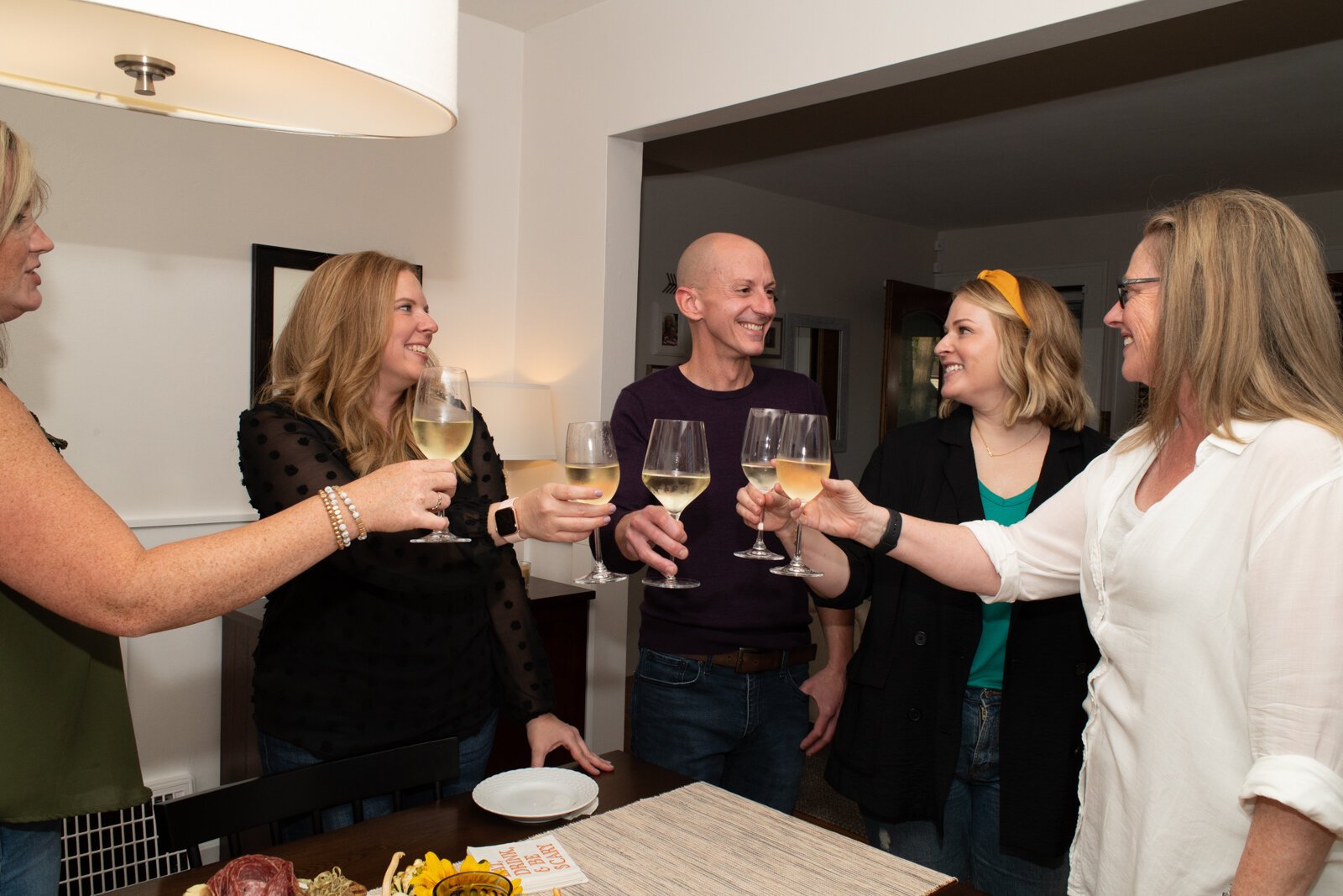 Kevin Christon spends time with friends in the dining room of his home in The '05.