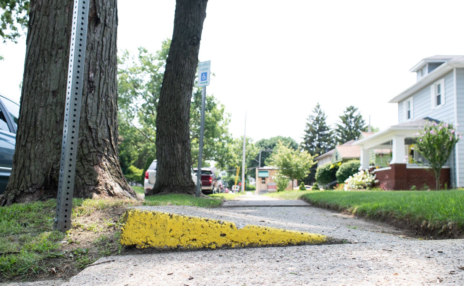 Uneven sidewalks, like those at the 1500 block of Kentucky Ave. in Fort Wayne, make transit challenging for wheelchair users.