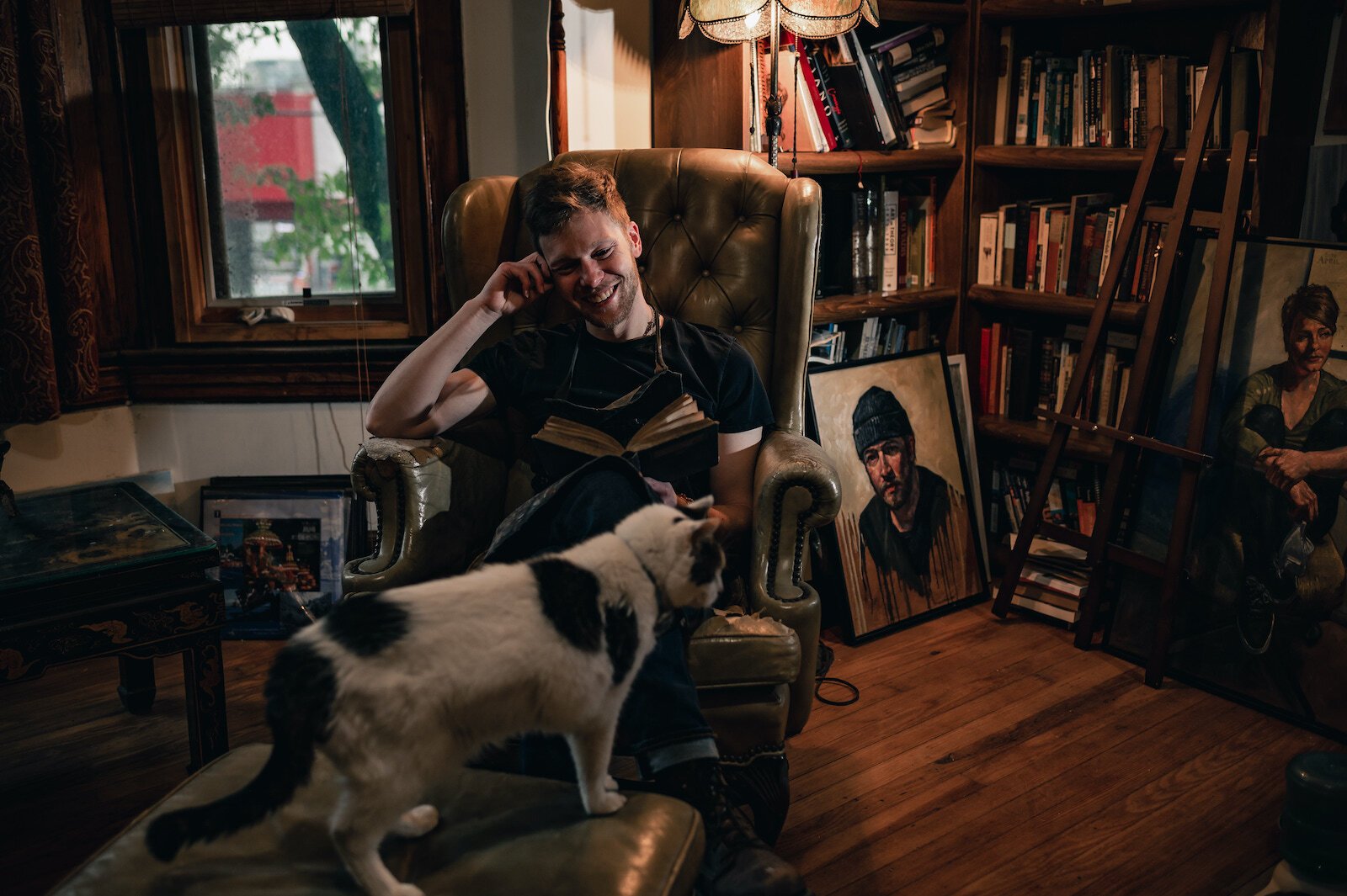 Artist Peter Lupkin, and his cat, in his art studio.