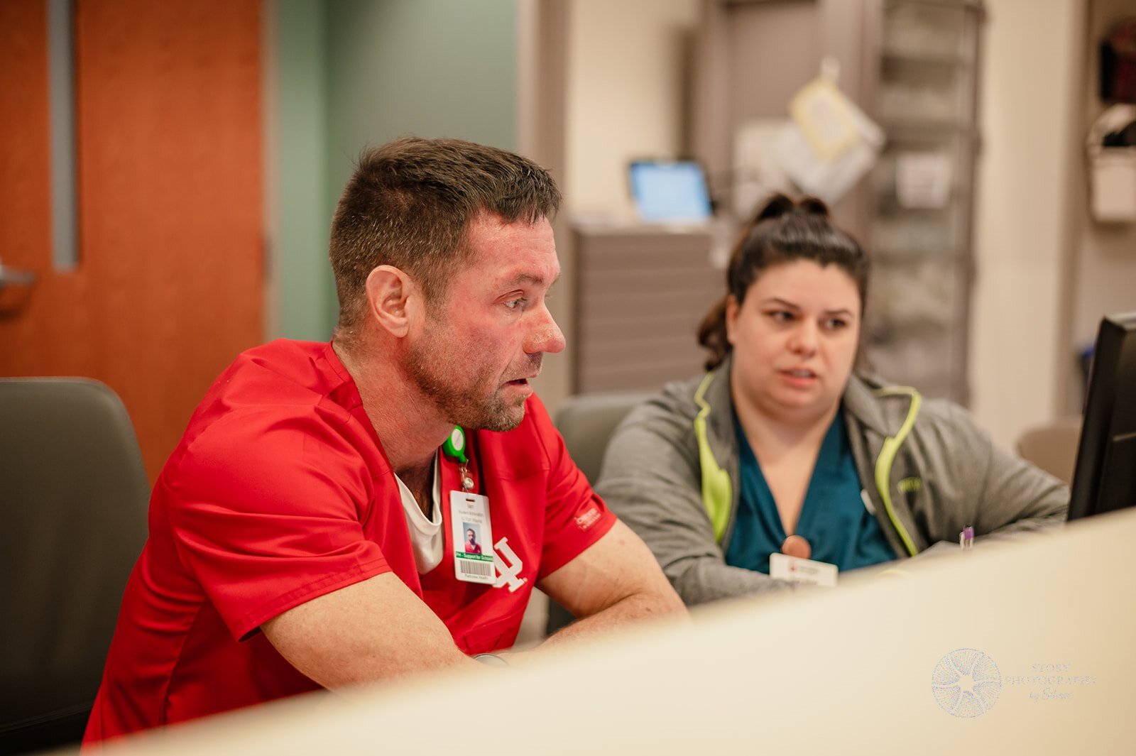 A student from Indiana University's School of Nursing Fort Wayne asks Parkview Nurse and Instructor Roni Elliott questions about electronic health records.