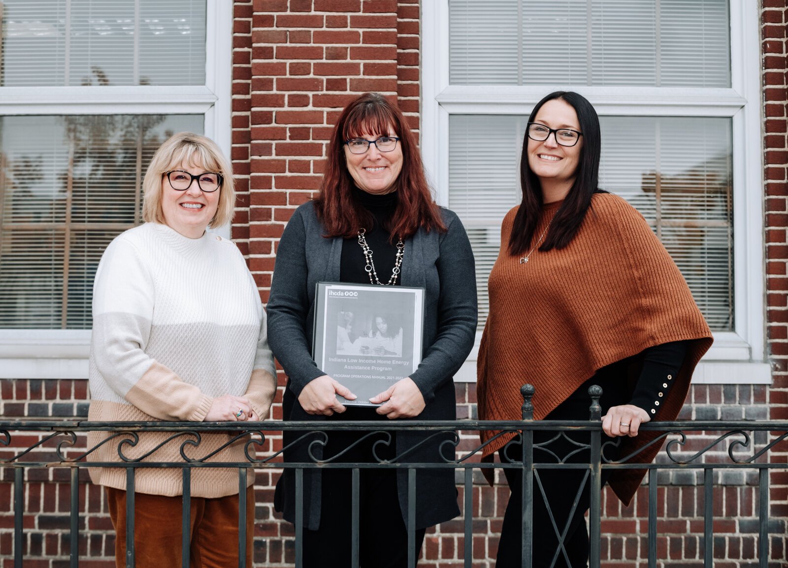 Brightpoint VP of Community Services, Pam Brookshire, left, and Family Support Services Manager, Lesa Cassel, center, with Dana Berkes, right, Public Affairs & Economic Development Manager at NIPSCO in front of Brightpoint at 227 E. Washington Blvd.