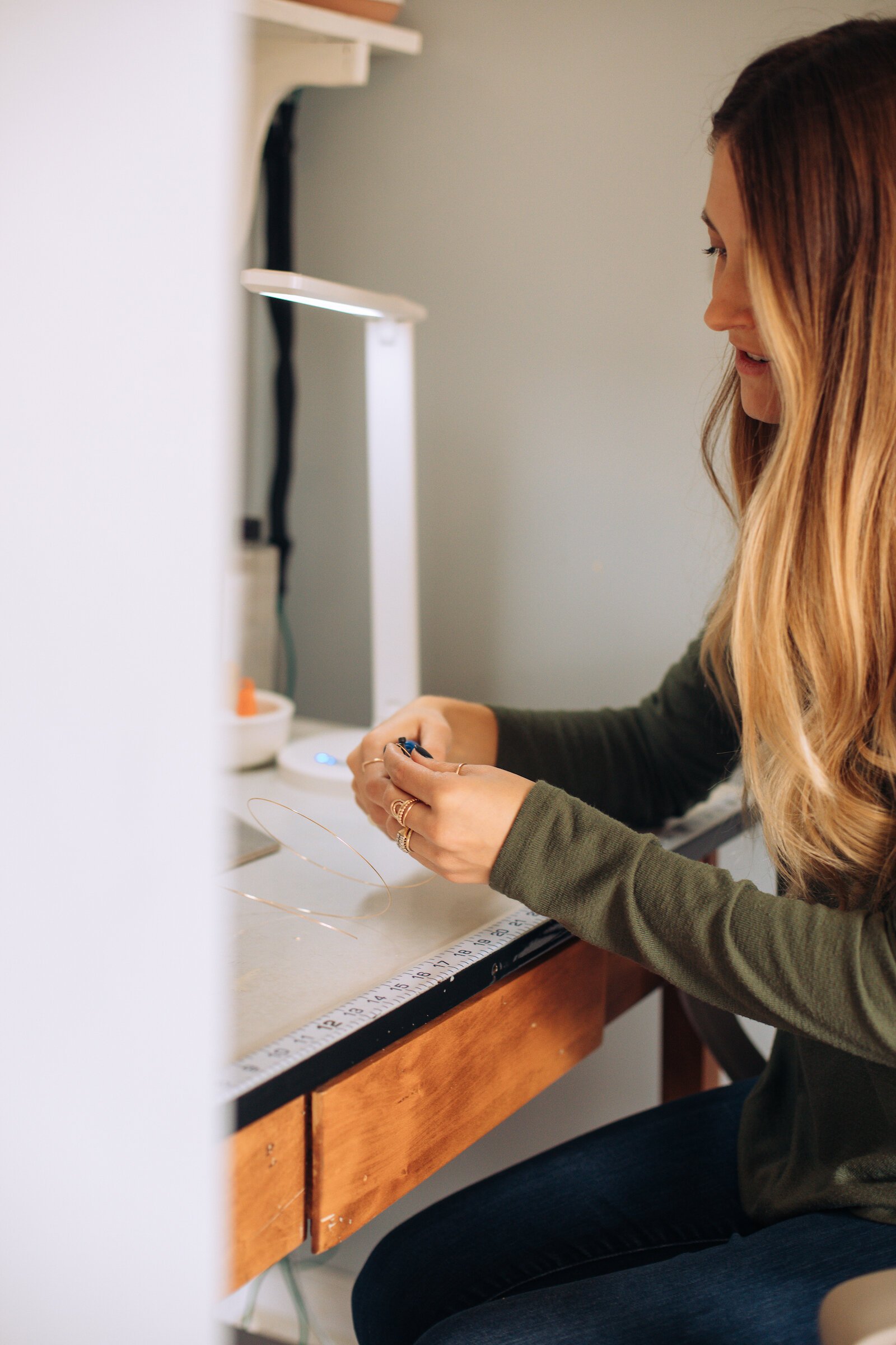 Still Remains Jewelry Owner Raelyn Bever works on a ring.